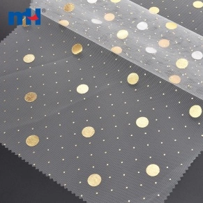 Tissu en maille à pois dorés