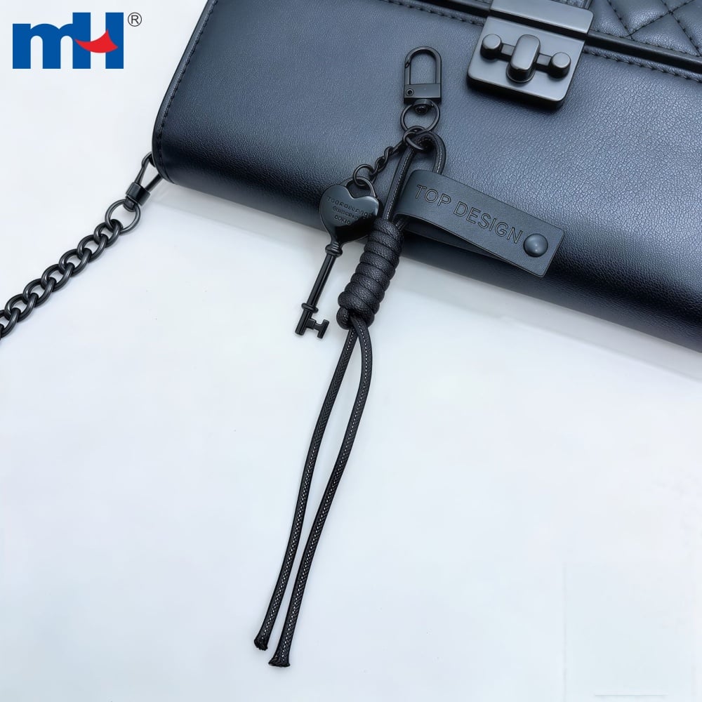 Black heart key charm styled on a handbag