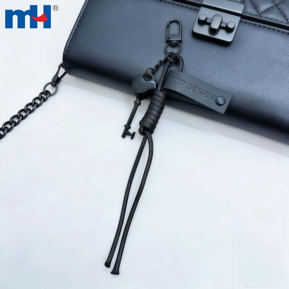 Black heart key charm styled on a handbag