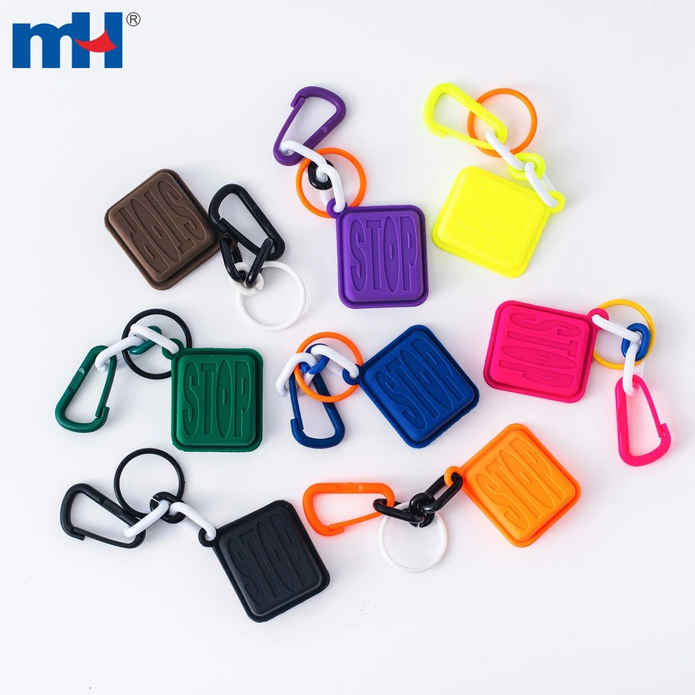 Full color range of STOP letter PVC charms laid flat