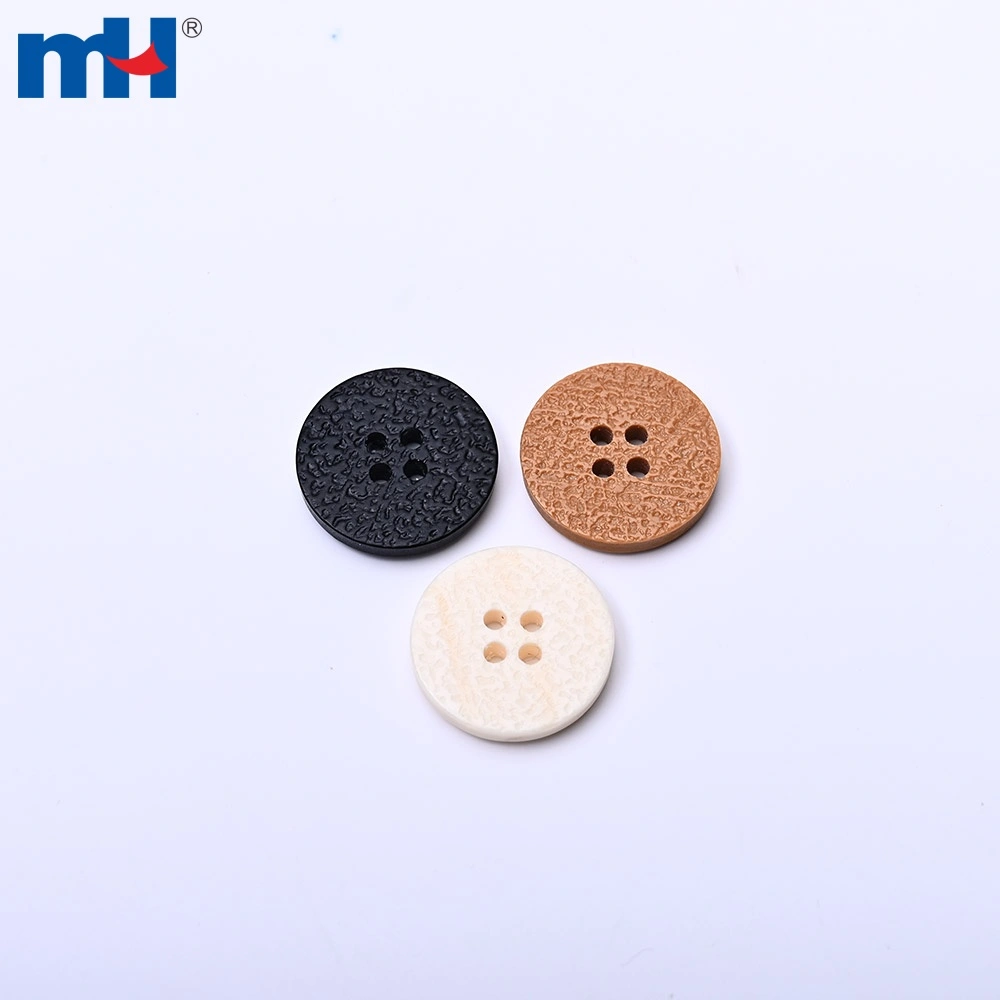 Chi tiết bề mặt nút áo bằng nhựa có vân xước