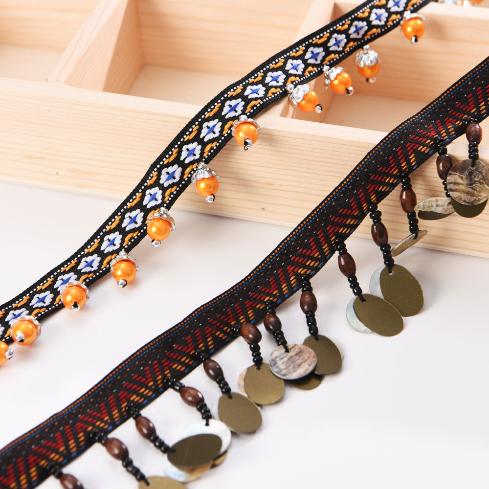 copper coin tassel fringe trim with polyester fringe and bead details