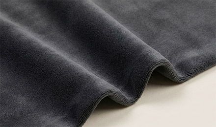 How Does Velvet Fleece Fabric Perform in Warmth, Softness, and Durability for Mass Production?