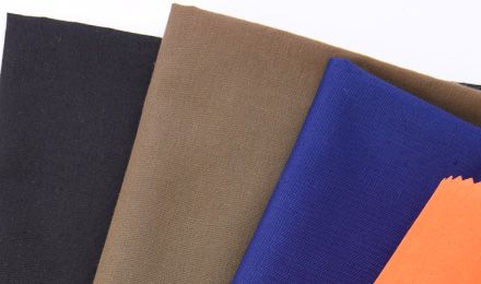 Why Do Manufacturers Choose 65/35 Poly Cotton Fabric for Workwear and Uniform Production?