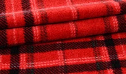 Why Do Manufacturers Choose Plaid Fleece Material for Blankets, Apparel, and Home Textiles?