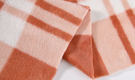 Why Do Manufacturers Prefer Polyester Flannel for Apparel, Blankets, and Home Textiles?