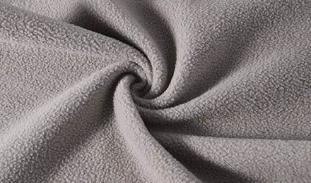 How to Choose the Right Wholesale Fleece Material Supplier for Large-Scale Garment Production?